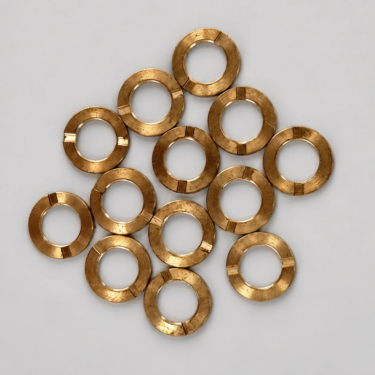 Brass slotted washer — AI-assisted studio presentation based on the original Chengshuo photograph