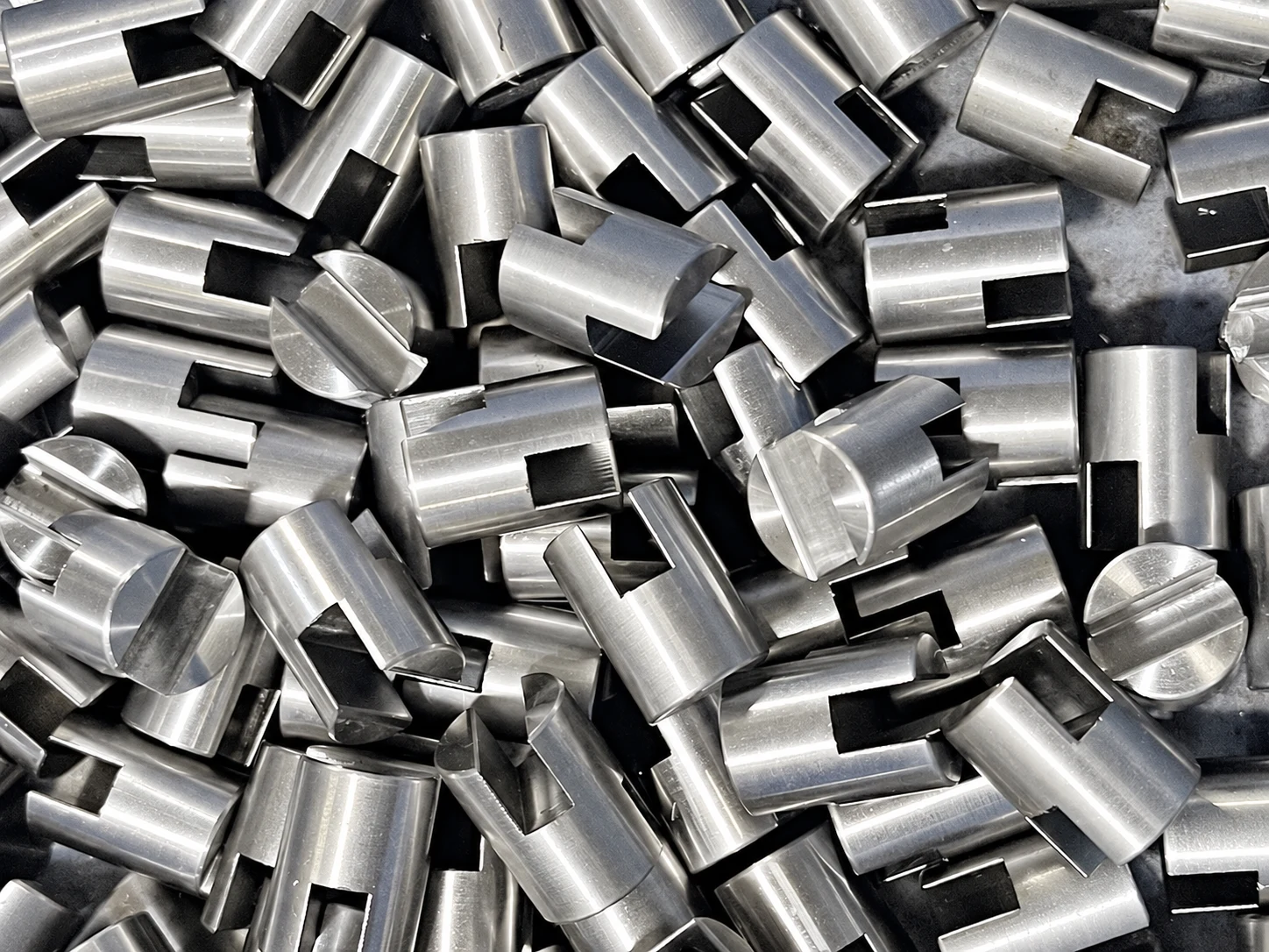 Stainless steel slotted valve part — AI-assisted studio presentation based on the original Chengshuo photograph