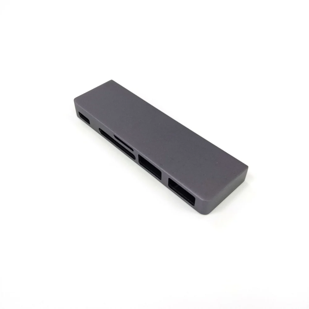 Original Chengshuo photograph of a slim aluminum enclosure with multiple side interface openings